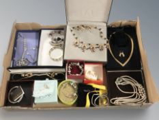 A collection of mainly boxed costume jewellery including charm bracelets,