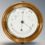 A circular beech barometer,