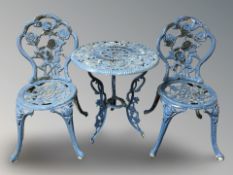 A painted cast iron patio table, 59 cm diameter,