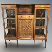 A late Victorian mahogany and satinwood inlaid bow front display cabinet, 138 cm x 43 cm x 141 cm.
