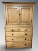 A Victorian pine press, 118 cm x 62 cm x 193 cm.