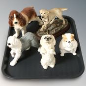 A Border Fine Arts figure 'Labrador Yellow', three Royal Doulton dogs and a further dog.