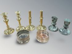 A pair of brass ejector candlesticks,