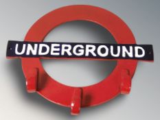 A cast iron London Underground coat rack, width 39 cm.