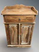 A mango wood side cabinet, 67 cm W x 46 cm D x 103 cm H.