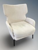 An Ilva armchair in oatmeal coloured fabric,