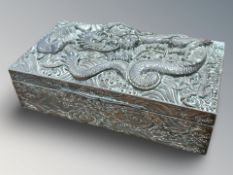 A Japanese embossed metal jewellery casket depicting a dragon, width 20.