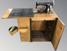 A Singer electric sewing machine in table