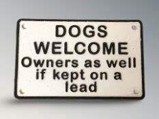 A cast iron 'Dogs Welcome' plaque, width 20 cm.