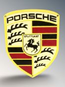 A cast iron Porsche plaque, height 30 cm.