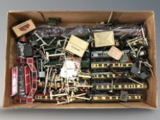 A quantity of die cast railway passenger cars and assorted model railway track accessories.