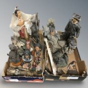 A group of Native American resin statues and figures.