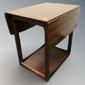 A reproduction mahogany drop leaf occasional table.