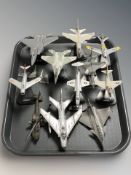 A group of die cast scale model fighter jets, helicopter, etc.
