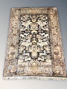 An Indian machine made rug, 186 cm x 130 cm.