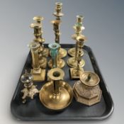 Three pairs of brass candlesticks plus several other singles.