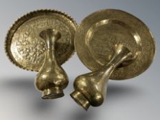 A continental engraved brass charger, diameter 45 cm, and a pair of vases.