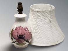 A Moorcroft Magnolia table lamp with shade, height up to fitting 26 cm.