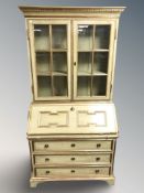 A continental painted and gilt bureau bookcase, 101 cm W x 48 cm D x 200 cm H.