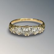 An antique 18ct gold five stone diamond ring, the total diamond weight approximately 0.