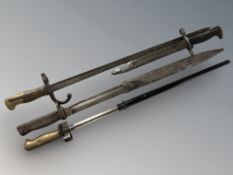 Four various bayonets including French gras and epee bayonets, etc, two with scabbards.