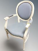 A French style painted open armchair.