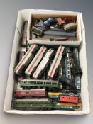 A quantity of die cast rolling stock including passenger cars and wagons, Tri-Ang, etc.