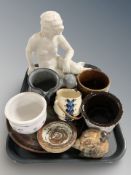 A group of Scandinavian stone ware vessels, planters, figure of a lady reclining on a rock.