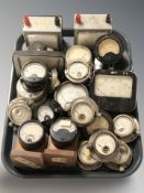 A collection of gauges measuring amps, volts, etc.