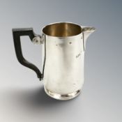 A silver cream jug, height 8 cm. CONDITION REPORT: 63.4g.
