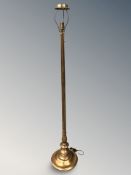 A gilt standard lamp and a further lamp, tallest 165 cm.