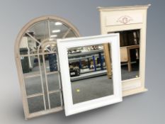 Three reproduction painted mirrors, largest 102 cm x 62 cm.