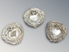Three pierced silver dishes, largest 10 cm long. CONDITION REPORT: 56.7g gross.