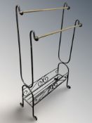 A wrought metal and brass rack,