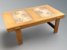 A Danish teak tile top rectangular coffee table, 142 cm x 80 cm x 53 cm.