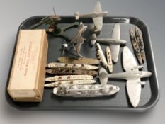 A group of die cast scale model battleships, aircraft,