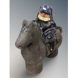An Asa Gustavsson studio pottery figure of a horse and rider, height 18 cm.