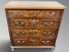 A 19th century continental walnut four drawer chest,