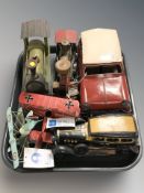 A group of tin plate cars, locomotive, two model biplanes.