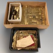 A quantity of stencilled brass model building components.