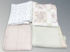 Four contemporary machine stitched padded quilts