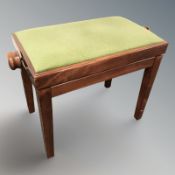 A reproduction adjustable piano stool