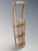 An early 20th century oak sledge,