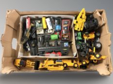 A group of modern die cast models including construction vehicles, locomotive, etc.