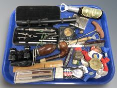 A precision drawing set, compass, hip flask, Swiss army knife, pens, pipe, etc.