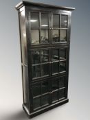 A glazed and ebonised six door bookcase, 105 cm W x 40 cm D x 213 cm H.