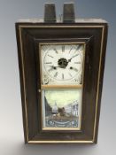An American eight day stained beech wall clock with weights, height 66 cm.