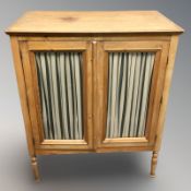 A glazed pine double door side cabinet, 88 cm x 49 cm x 107 cm.