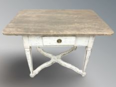 A French style rustic painted pine single drawer table,