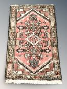 A small Iranian rug, 93 cm x 56 cm.